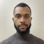 A headshot photograph of Yoan Tsika