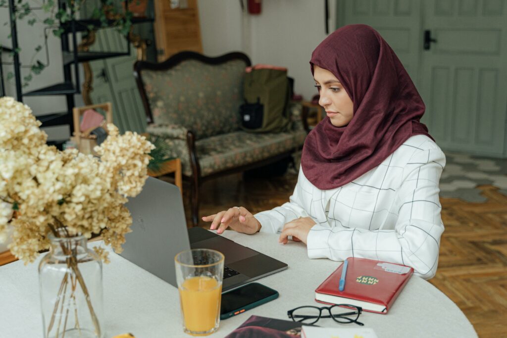 Antoni Shkraba for Pexels. Young woman works at a laptop.