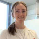 Image of a female scientist wearing a white coat