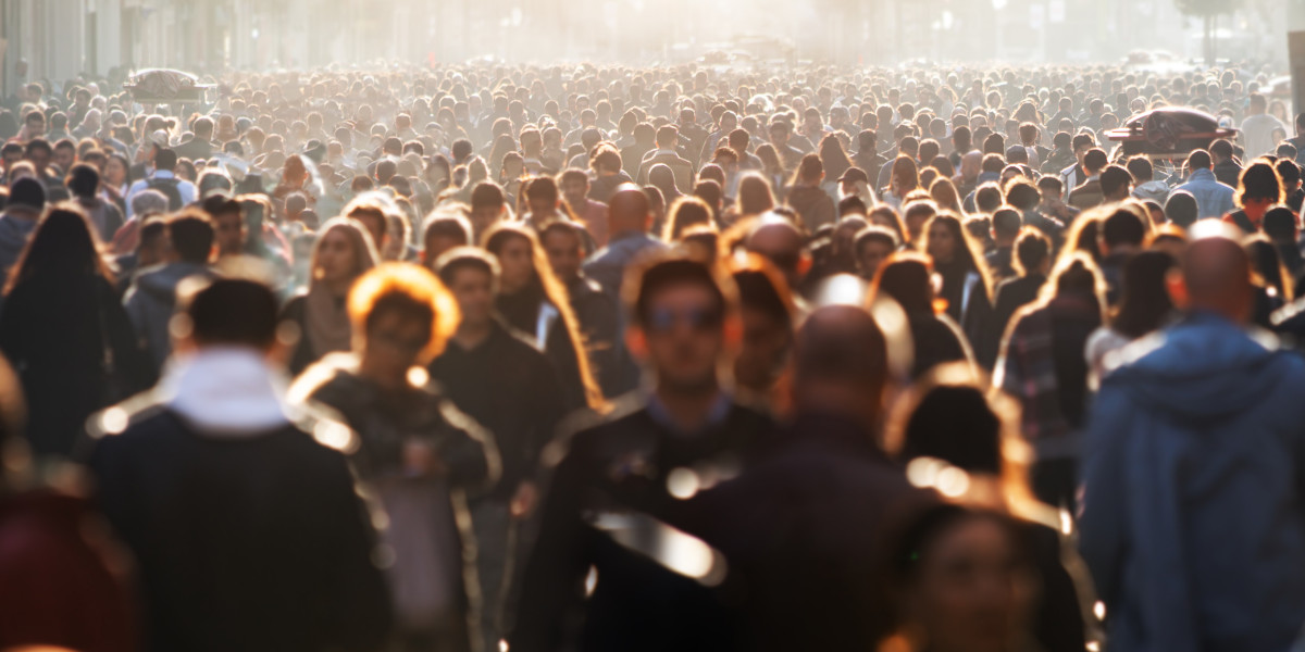 Crowd of people walking along a street, used to illustrate the Poverty in Data event hosted by the UK Data Service.