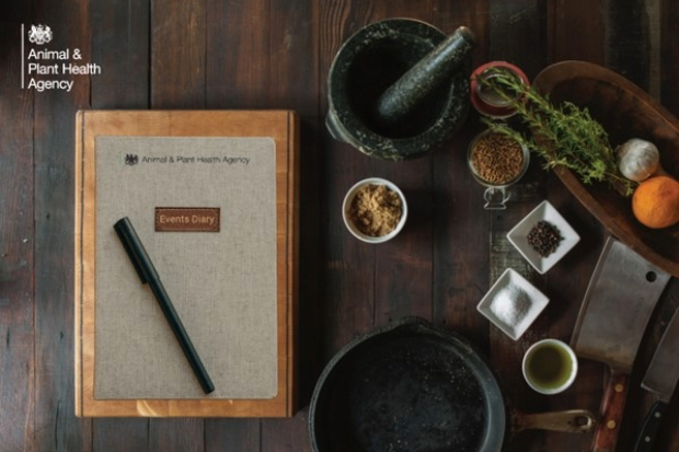 Image of a book with a label saying, "Events diary" next to cooking utensils and ingredients.