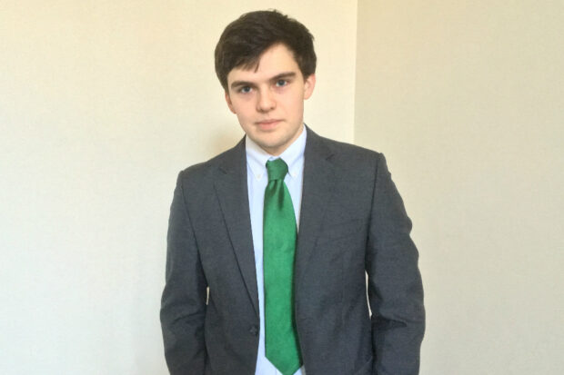 Apprentice Toby standing with his hands in his pockets