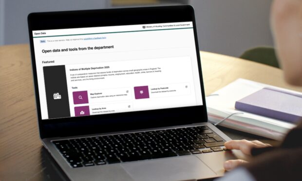 The homepage of the Open Data Communities platform shown on a laptop screen