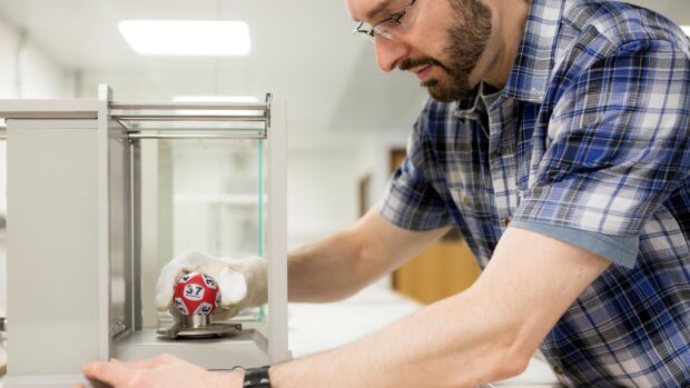 OPSS colleague testing a lottery ball in a lab