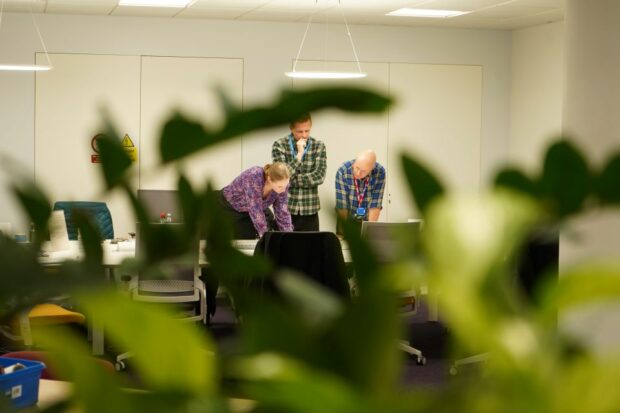 A trio of civil servants at a sprint event.