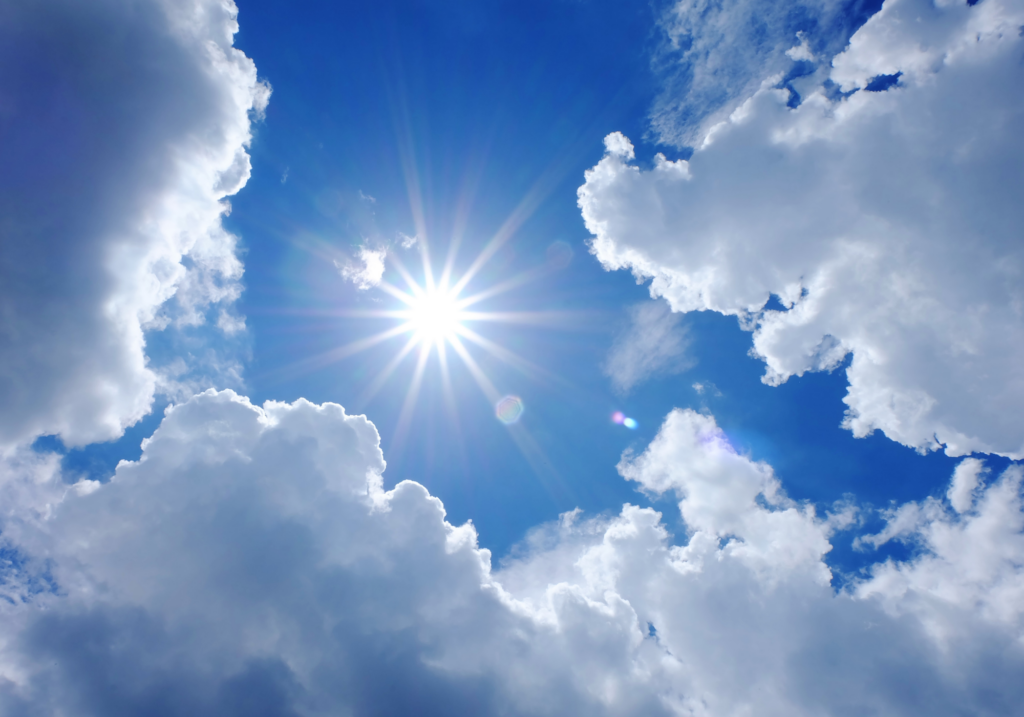 A blaring sun in a blue sky.