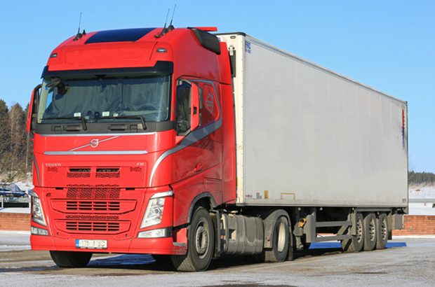 Red lorry with curtain sided trailertrailer