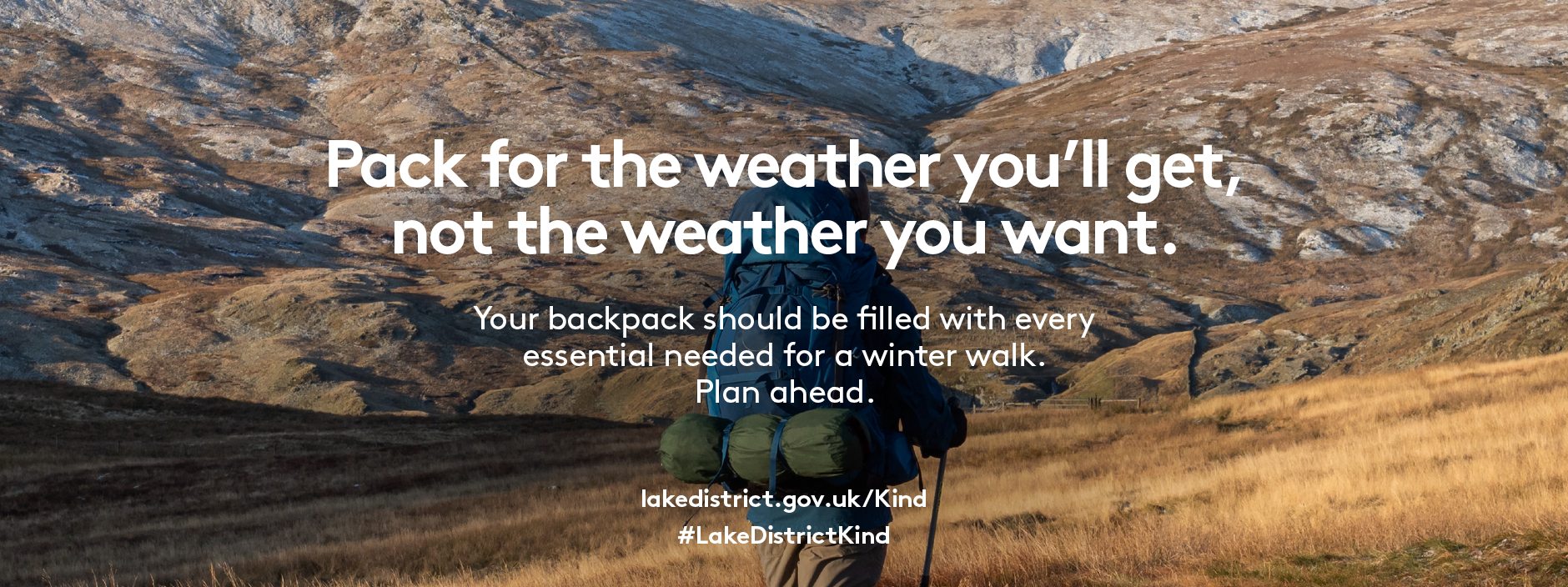 A walker with a full rucksack walking along a fell top with text overlay reading Pack for the weather you'll get, not the weather you want. Your backpack should be filled with every essential needed for a winter walk. Plan ahead.
