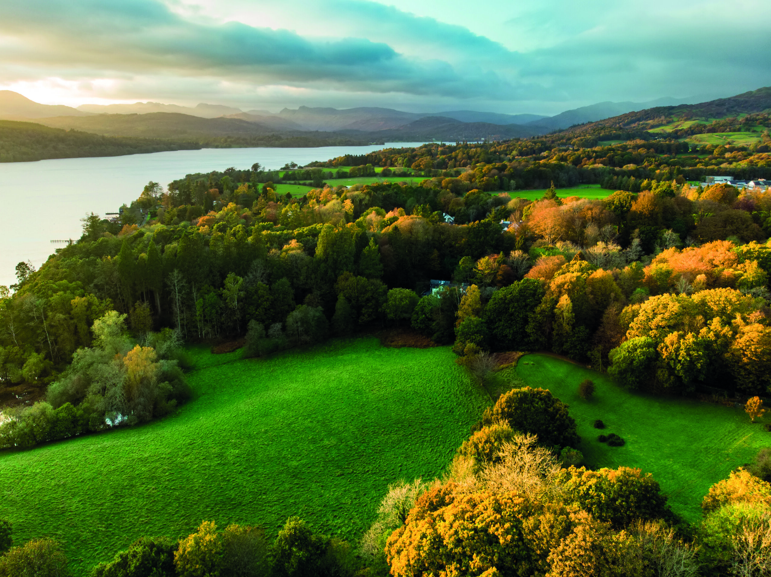 Aerial view of Windermere lake, the largest natural lake in both the Lake District and in England, Cumbria, UK. Sunny autumn evening in the Lakeland.