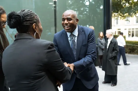 Deputy Prime Minister and Lord Chancellor, David Lammy, shaking hands with a probation officer outside the Probation Service