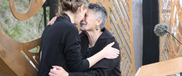 At the Tuia 250 celebration, the HC Laura Clark is touching foreheads with someone else.