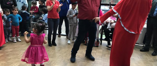 A family dancing as they celebrate Nowruz in a temporary accommodation facilities for migrant families in Bihac