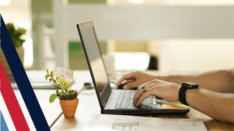 Hands on a laptop, showing how VALOUR can help you find veteran support online.