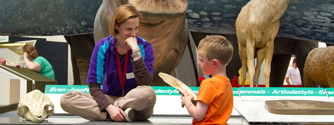 A Learning Volunteer sharing a specimen with the public
