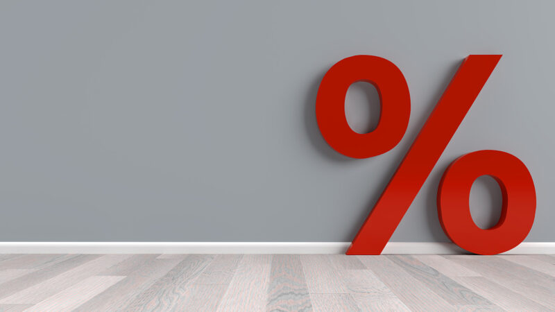 A percentage sign against a wall symbolising armed forces discounts for veterans.