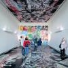 Audiences walk on and through Thomas Kilpper's exhibition titled The Politics of Heritage vs The Heritage of Politics which itself is etched into the floor, ceiling and walls of the space.