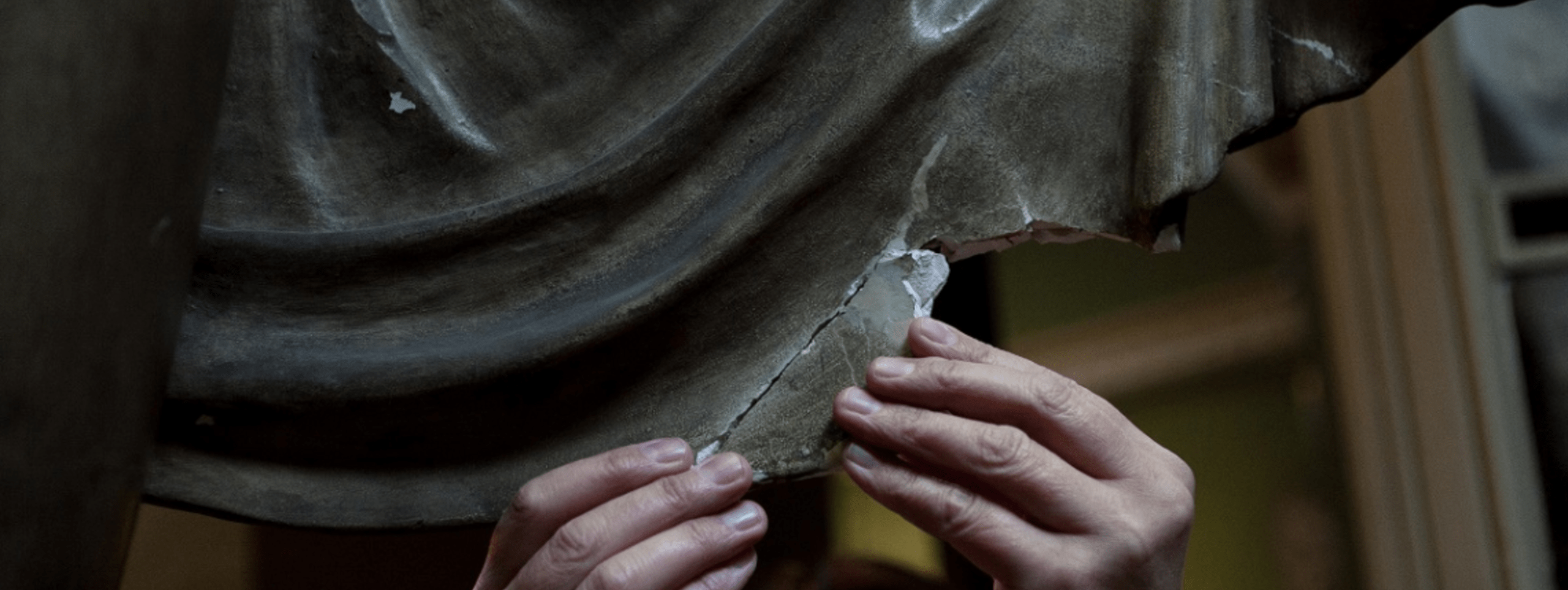 Jane Wilkinson, Head of Conservation, repairing the cloak on the plaster cast of Apollo.
