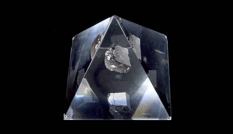 A Moon rock specimen housed in a glass prism