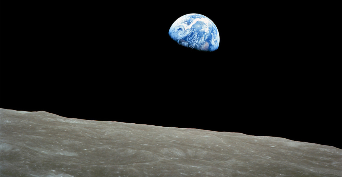 The Earth rises over the Moon