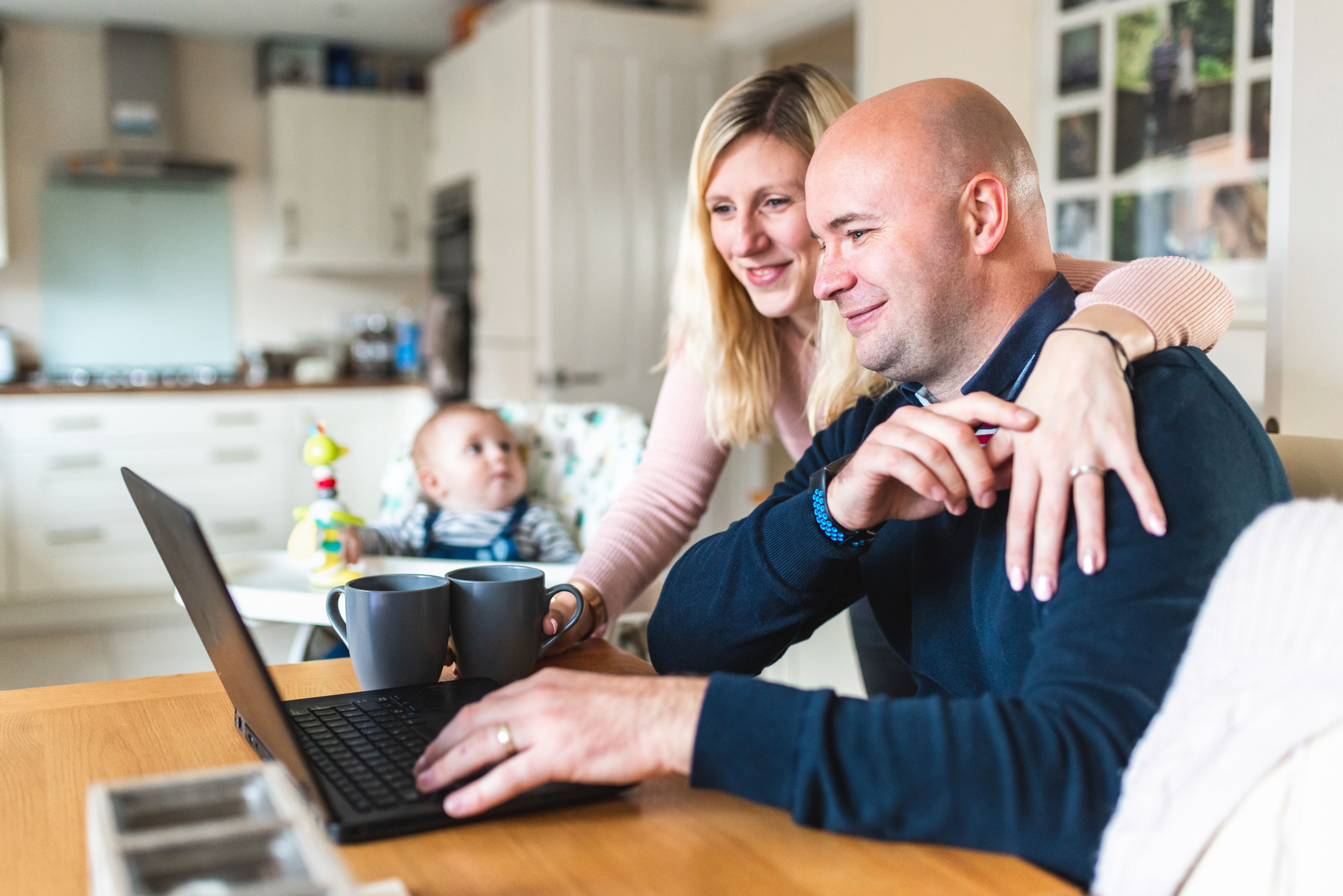 Couple on table with baby