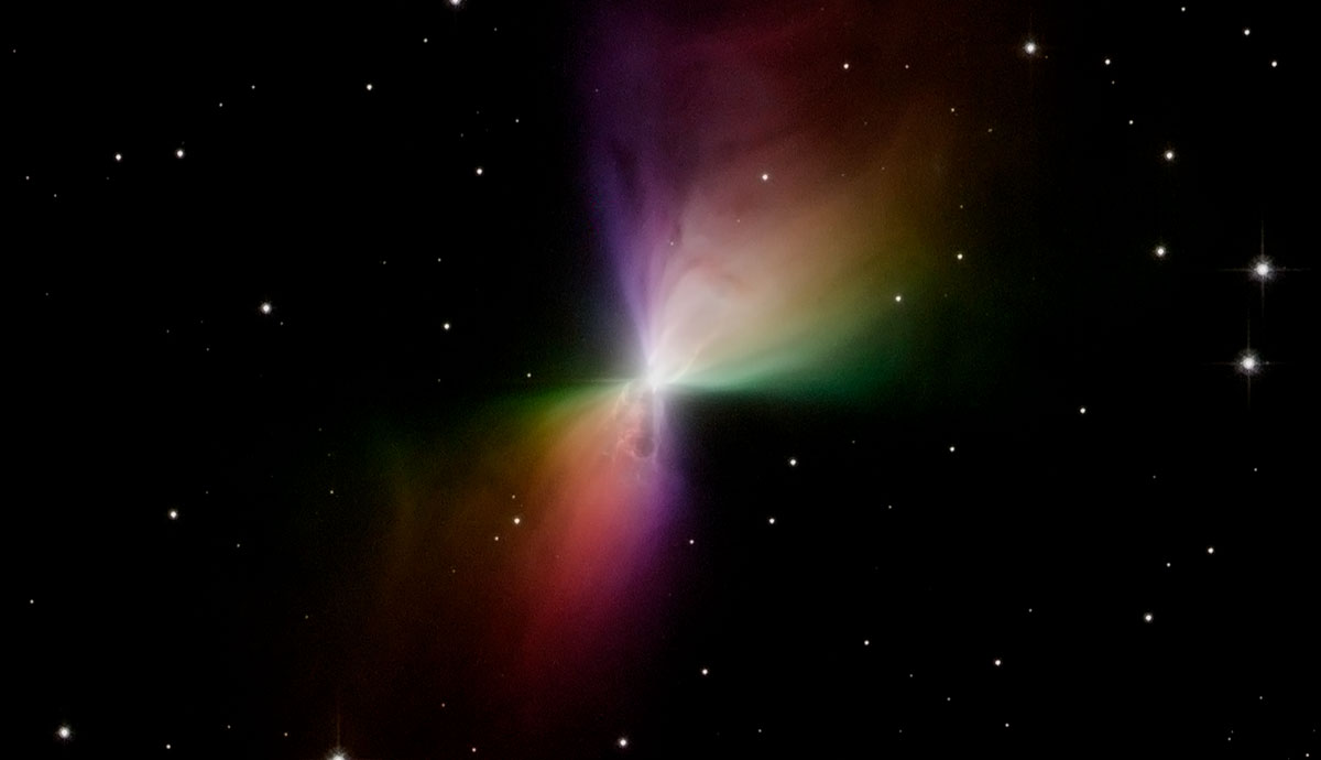 A colourful cloud of gas and dust that's brightest at its center, all floating in outer space