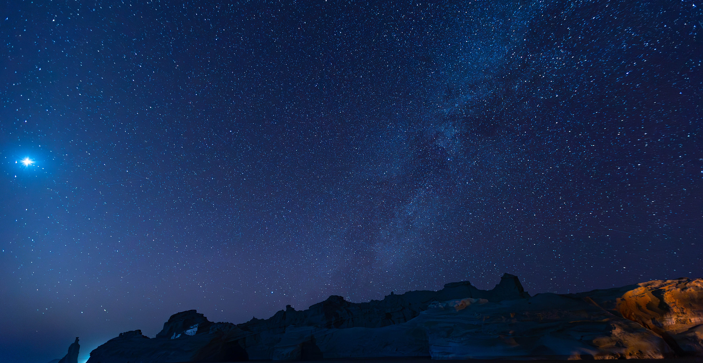 Night sky with the Milky Way and the Moon