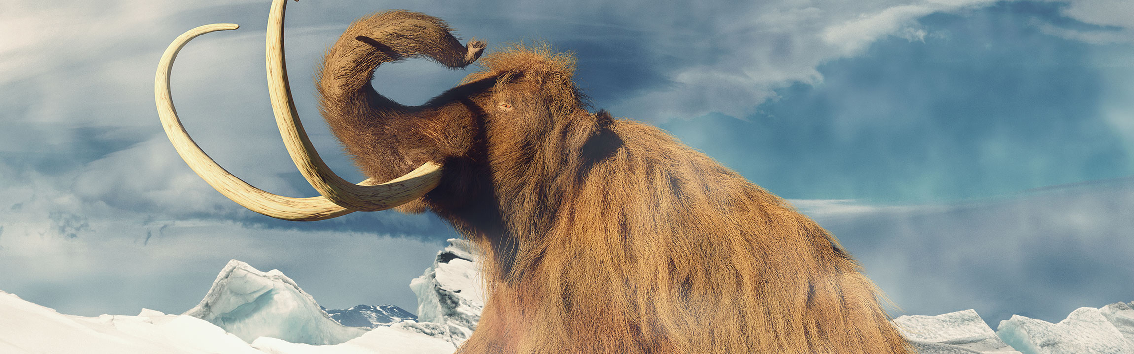 A woolly mammoth covered in thick, auburn hair standing in a desolate snowy landscape.