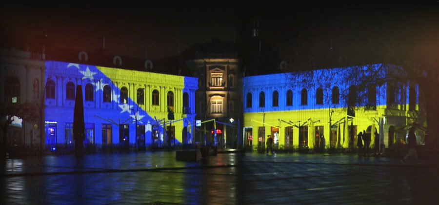 Barok building in Tuzla lit in colours of Bosnian and Ukrainian flags