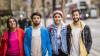 Four students walking on the street