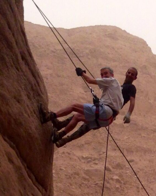British Ambassador Peter Millett abseiling in Wadi Numeira