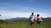 Two hikers admire the Patagonian mountains.