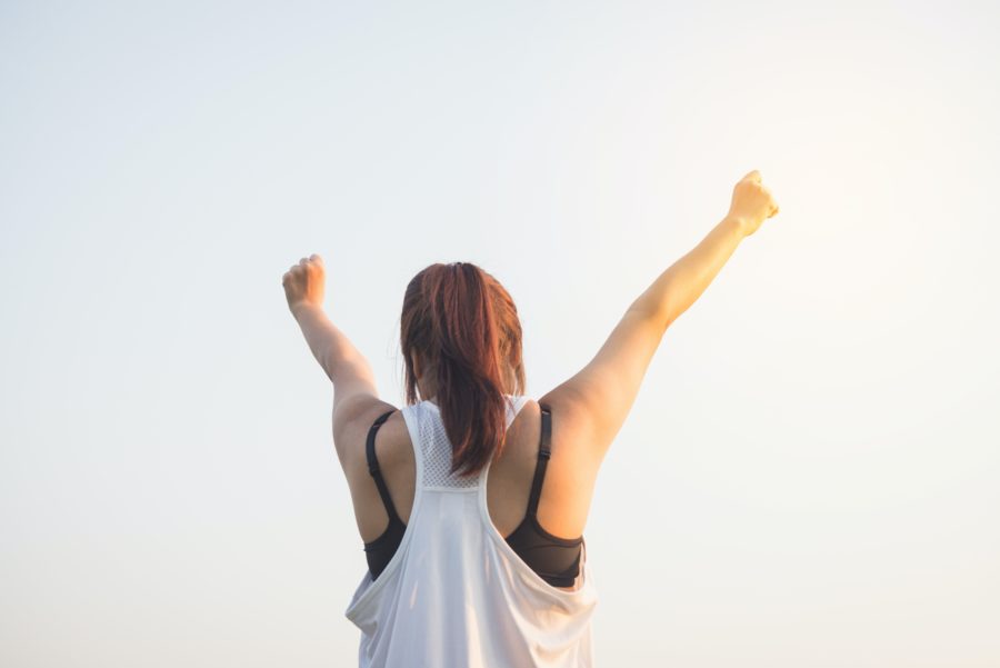 Woman with arms in air