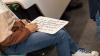 Student practises writing arabic script