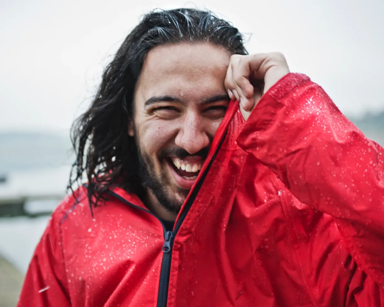 Student smiling in a red jacket