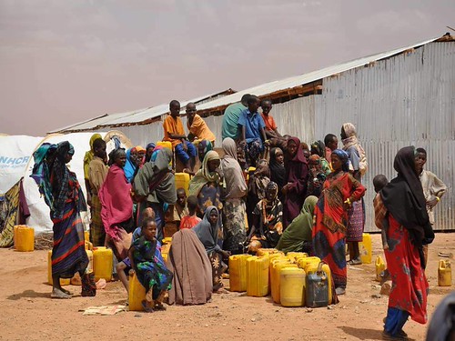 Collecting clean drinking water in refugee camp in Ethiopia