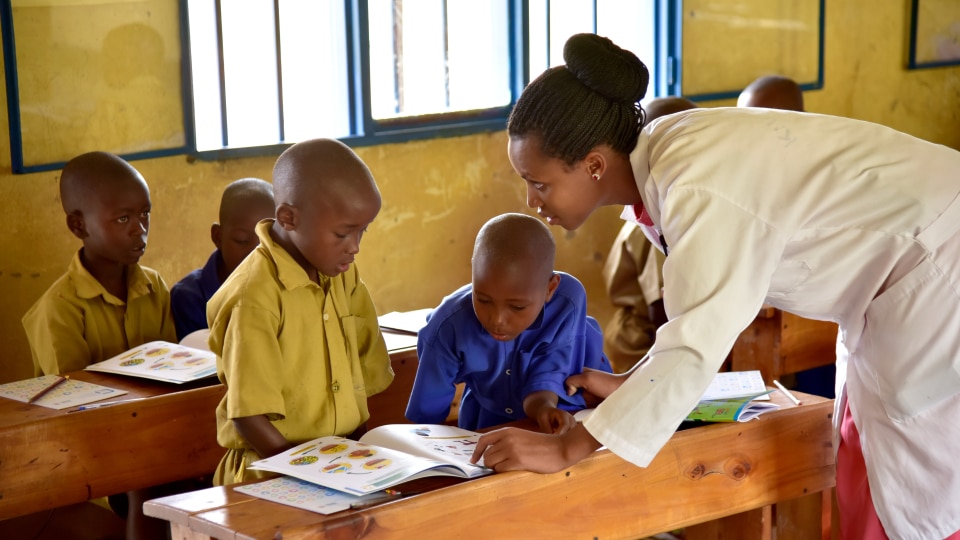 children and a teacher in a classroom