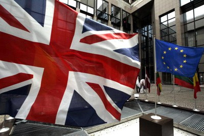 A European Flag and the Union Jack hang in front of the Justus Lipsius, the European Union's headquarters building in Brussels. GERARD CERLES/AFP/Getty Images