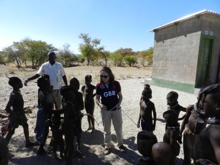 H.E. Marianne Young teaching children in Kunene region how to how to skip with a jumping rope.