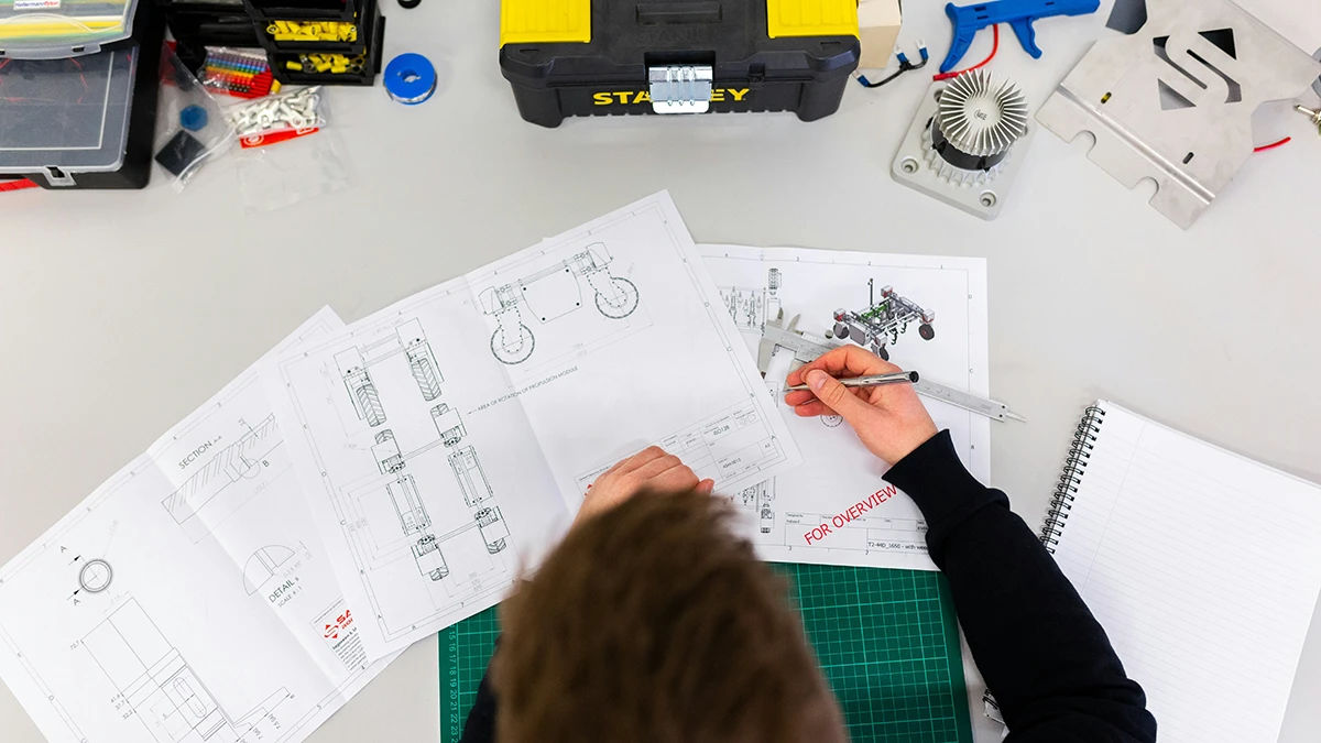 man reading technical engineering documentation