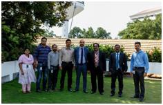 Sam (second from right) and Murtaza (centre) with the Technopark team