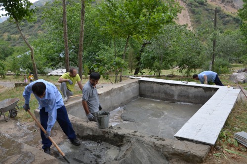 Embassy staff helping to renovate a holiday camp for underprivileged children in Romit