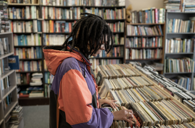Someone looking through rows and rows of vinyls.