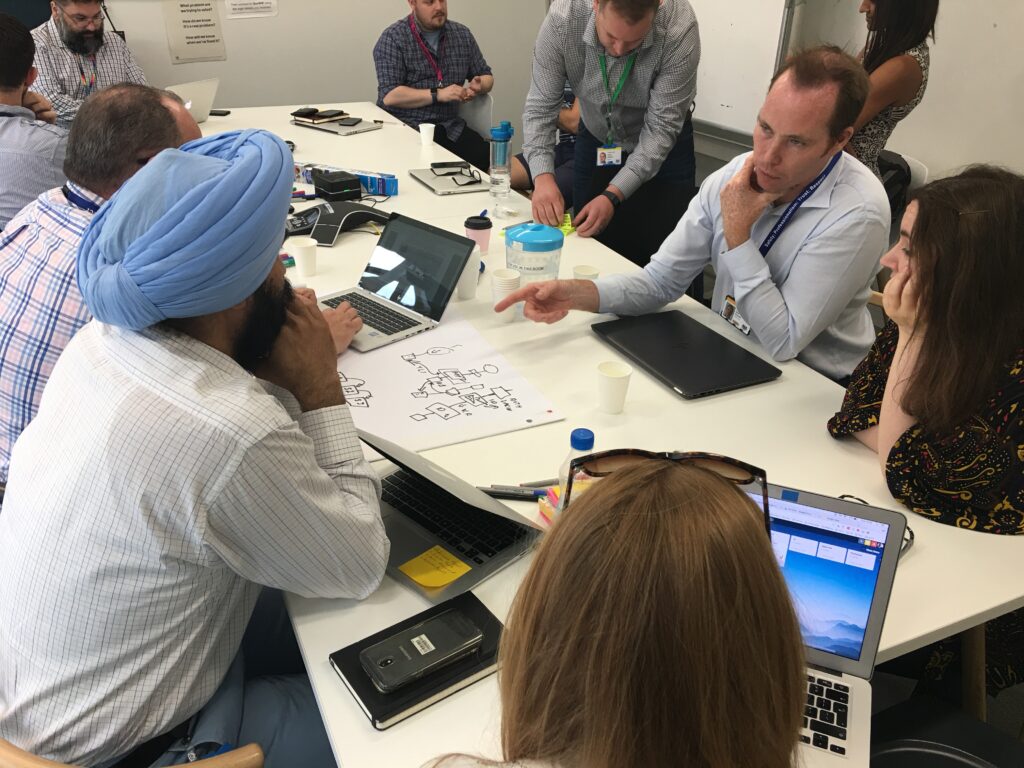 Consulting Technical Architects discussing technology with cross government technologists