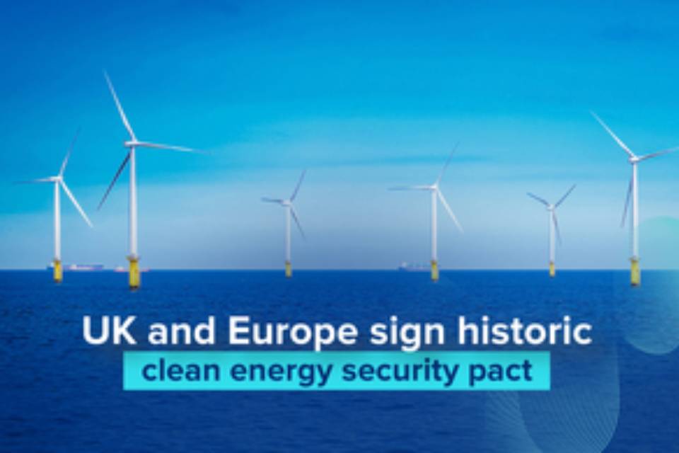 Offshore wind turbines standing in a calm blue sea under a clear sky, with text overlaid that reads: ‘UK and Europe sign historic clean energy security pact’.