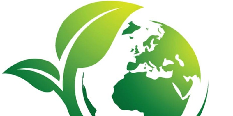 A map of the world in green with a leaf motif