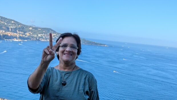 Sree in front of a sea view