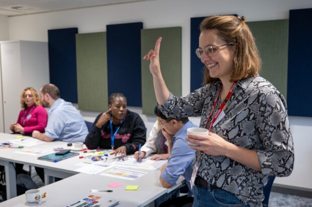 A photo of people participating in a design workshop.