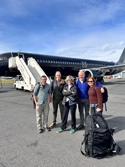 Group shot in front of the plane at Stansted: (From left to right) Emilio (UKHSA), Tom (UK-PHRST and LSHTM), Renu (UKHSA), Matthew (UK-Med), Kate (UK-Med).