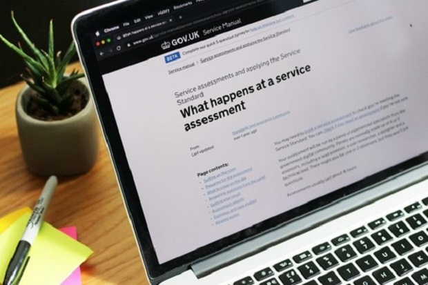 A laptop screen displaying the words 'what happens at a service assessment'