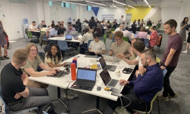 Teams collaborating at the hackathon